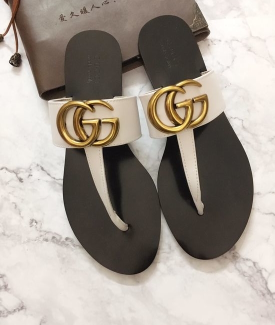 Gucci Cowhide Upper Flip Flops with Metal Decor