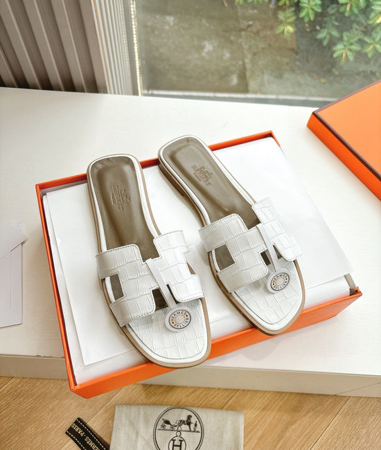 Hermes Flat Slide Sandals with Metal Lock Buckle and Leather Upper