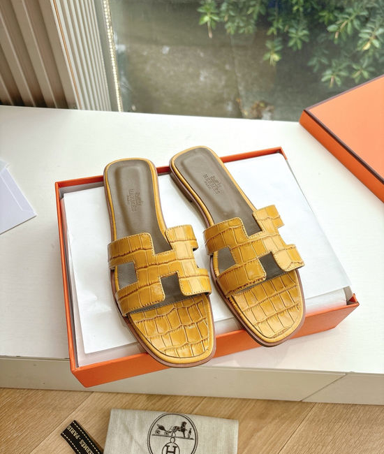Hermes Flat Slide Sandals with Metal Lock Buckle and Leather Upper