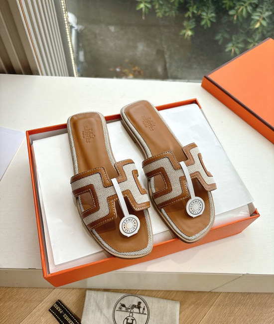 Hermes Flat Slide Sandals with Metal Lock Buckle and Leather Upper