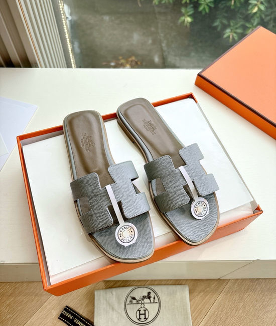 Hermes Flat Slide Sandals with Metal Lock Buckle and Leather Upper