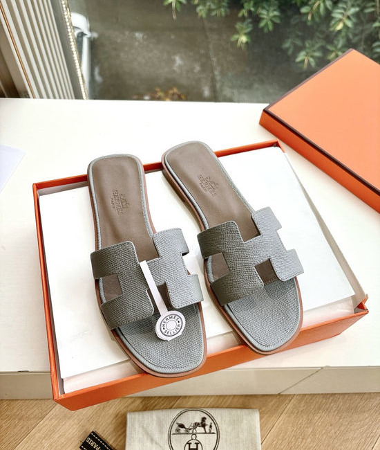 Hermes Flat Slide Sandals with Metal Lock Buckle and Leather Upper