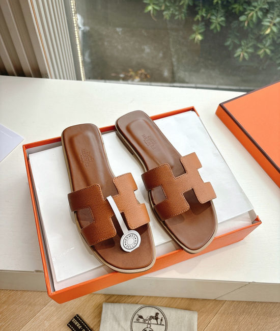 Hermes Flat Slide Sandals with Metal Lock Buckle and Leather Upper