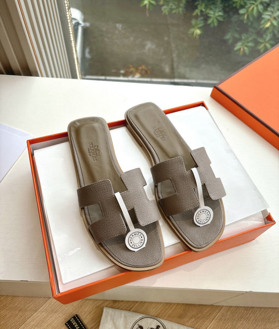 Hermes Flat Slide Sandals with Metal Lock Buckle and Leather Upper