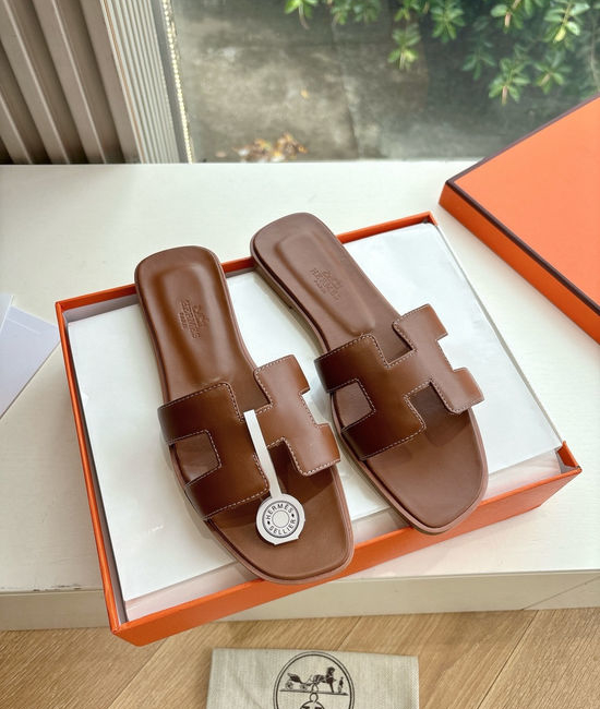 Hermes Flat Slide Sandals with Metal Lock Buckle and Leather Upper
