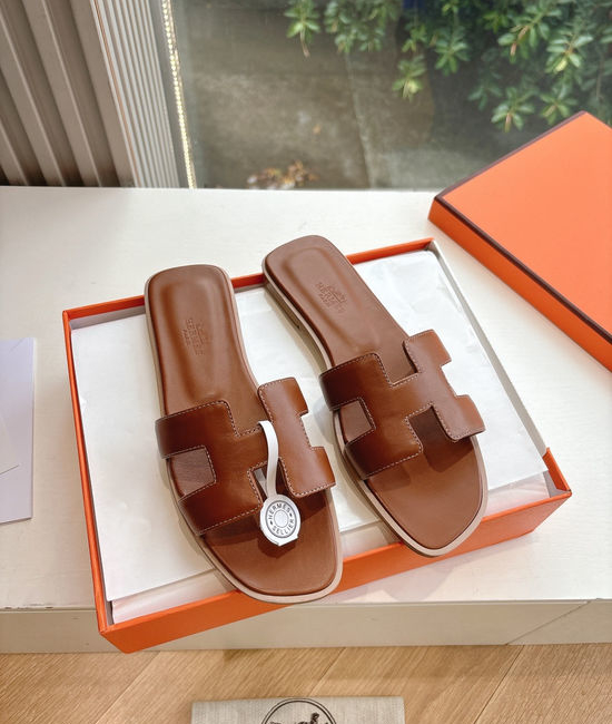 Hermes Flat Slide Sandals with Metal Lock Buckle and Leather Upper