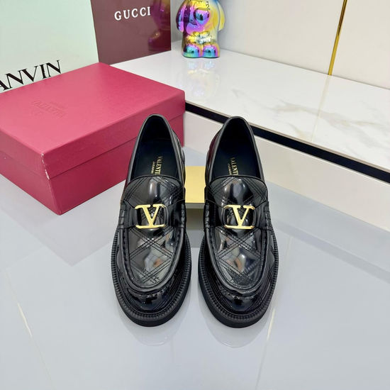 Valentino Elegant Metal Element Flats with Exquisite Rivet Accents