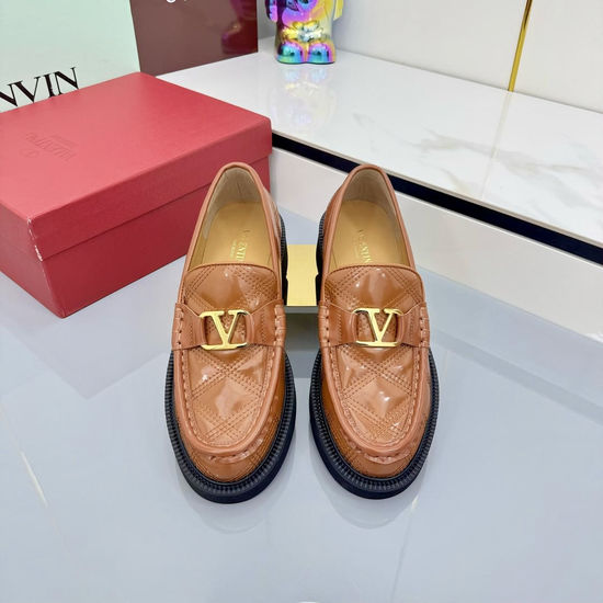 Valentino Elegant Metal Element Flats with Exquisite Rivet Accents