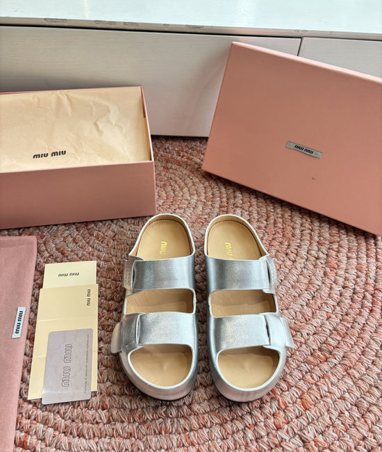 Miu Miu Soft Leather Slip On Sandals With Metal Emblem Detail