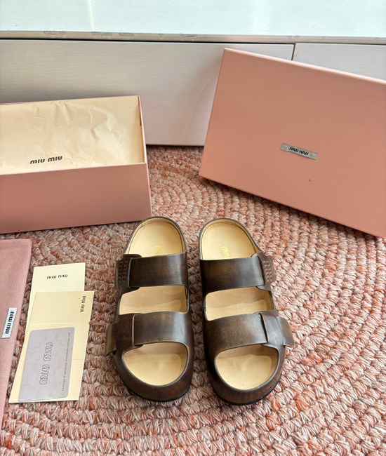 Miu Miu Soft Leather Slip On Sandals With Metal Emblem Detail