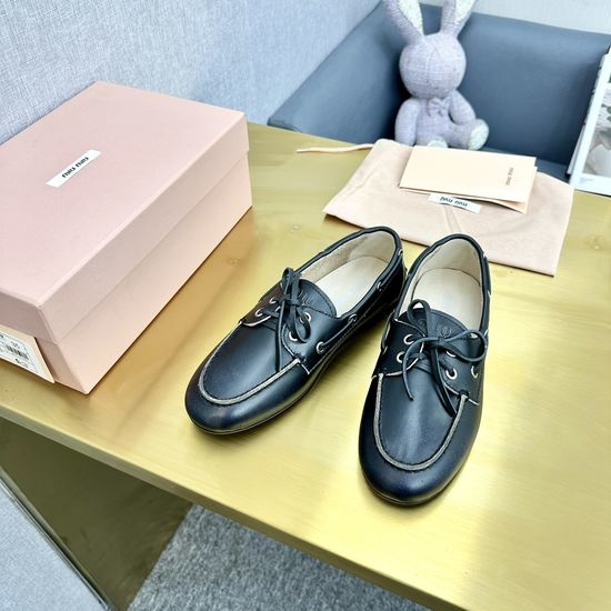 Miu Miu Vintage Distressed Leather Loafers with Bow Decor