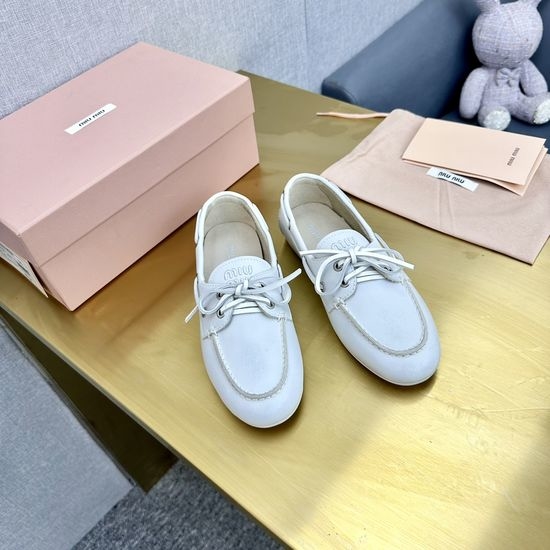 Miu Miu Vintage Distressed Leather Loafers with Bow Decor