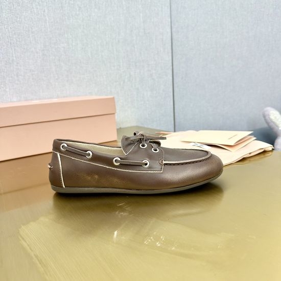 Miu Miu Vintage Distressed Leather Loafers with Bow Decor