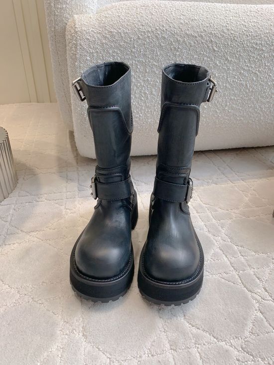 Balenciaga Distressed Leather Moto Boots with Decorative Metal Buckles