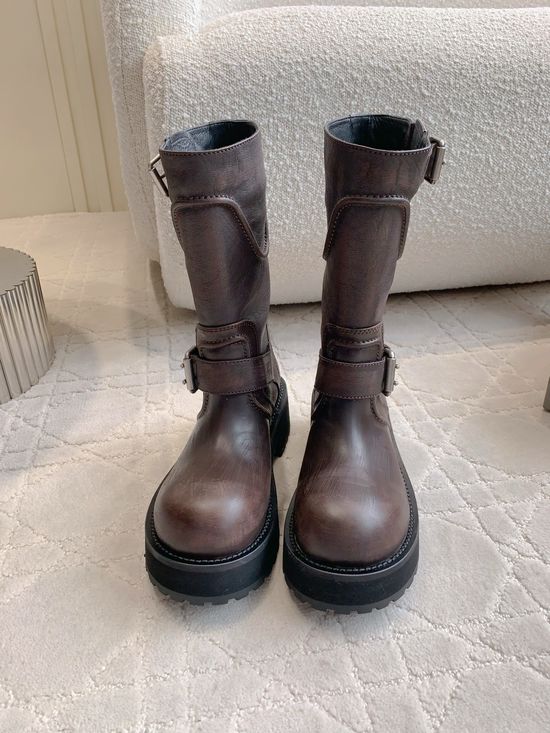 Balenciaga Distressed Leather Moto Boots with Decorative Metal Buckles