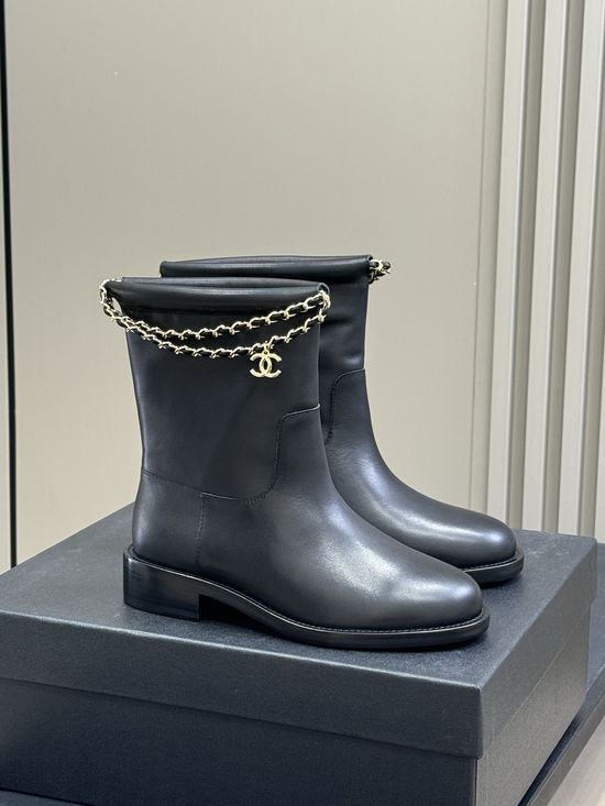 Chanel Elegant Leather Ankle Boots With Decorative Chain Detail