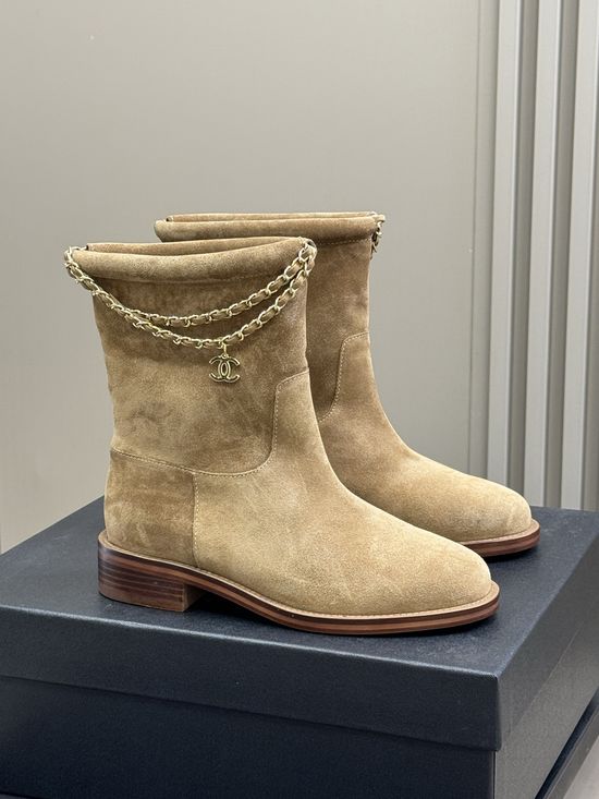 Chanel Elegant Leather Ankle Boots With Decorative Chain Detail