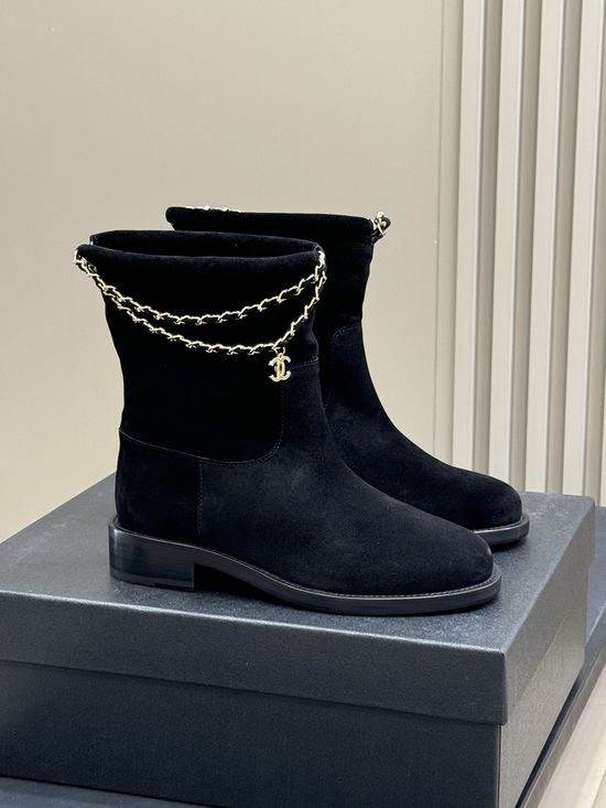 Chanel Elegant Leather Ankle Boots With Decorative Chain Detail