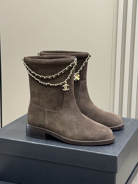 Chanel Elegant Leather Ankle Boots With Decorative Chain Detail