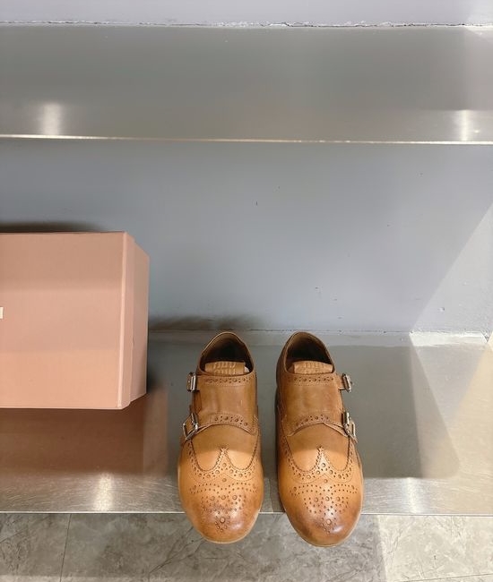 Miu Miu Engraved Brogue Loafers with Tassel Details