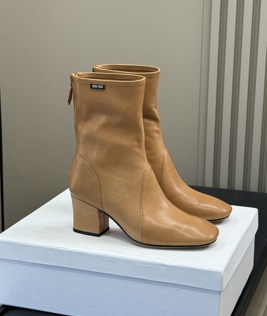 Miu Miu Knee High Stretch Boots With Decorative Metal Buckle