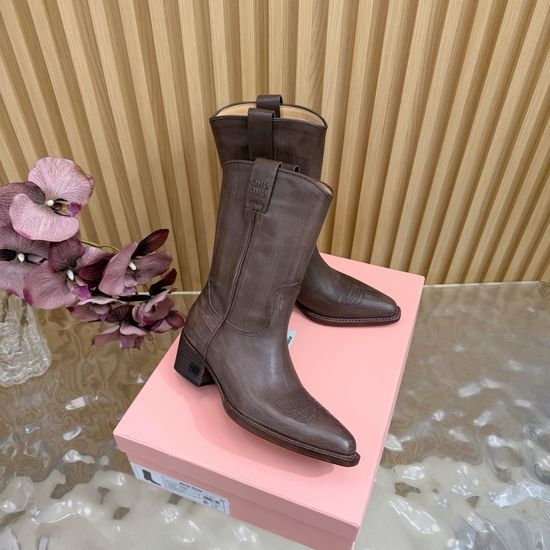 Miu Miu Pointed-Toe Knight Boots with Sleek Silhouette