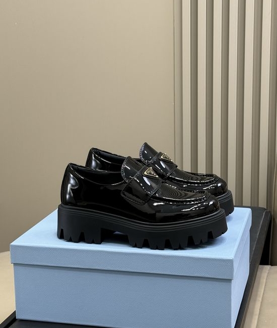 Prada Premium Leather Loafers With Gold Emblem And Chunky Heel