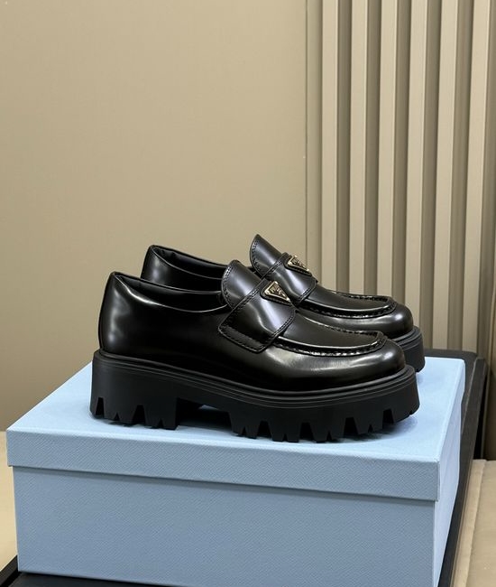 Prada Premium Leather Loafers With Gold Emblem And Chunky Heel