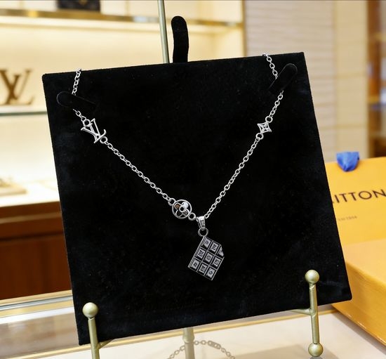 Louis Vuitton LV Hollow Letter Floral Pattern Charm Pendant