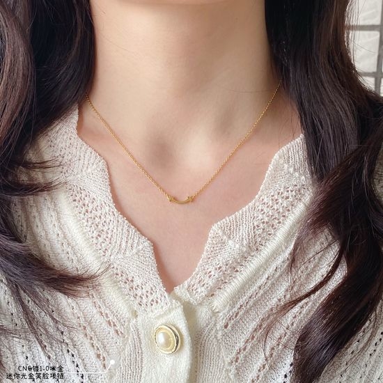 Tiffany & Co. Mini Gold Smile Pendant Necklace