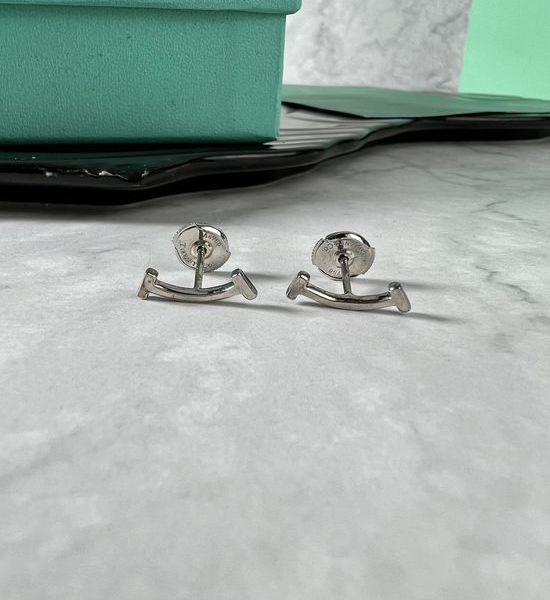 Tiffany & Co. Sleek Minimalist Polished Stud Earrings