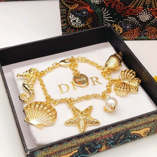 Christian Dior CD Seahorse Star Brass Stud Earrings