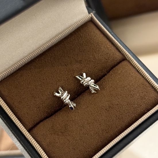 Tiffany & Co. Sleek Knot Design Sterling Silver Earrings