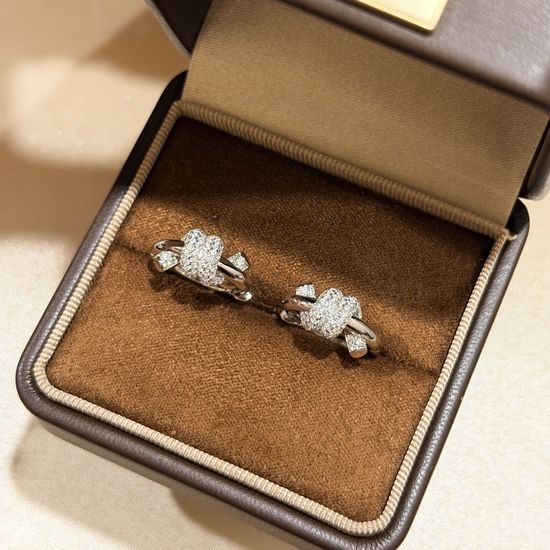 Tiffany & Co. Half Diamond Knot 925 Silver Stud Earrings