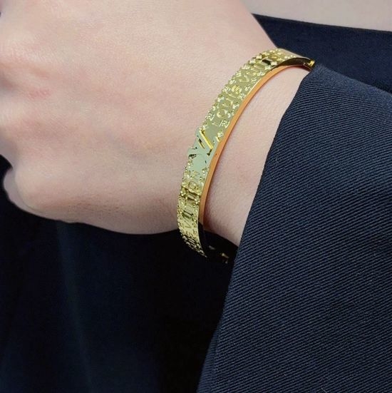 Louis Vuitton LV Clover Carved Gold Tone Bangle